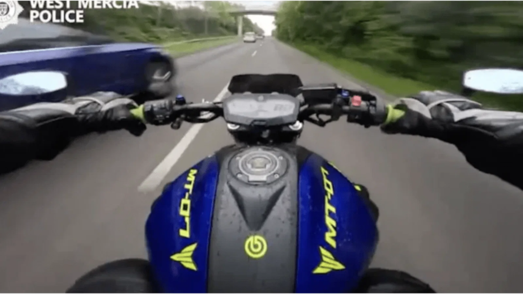 Motorcyclist speeding in the UK.