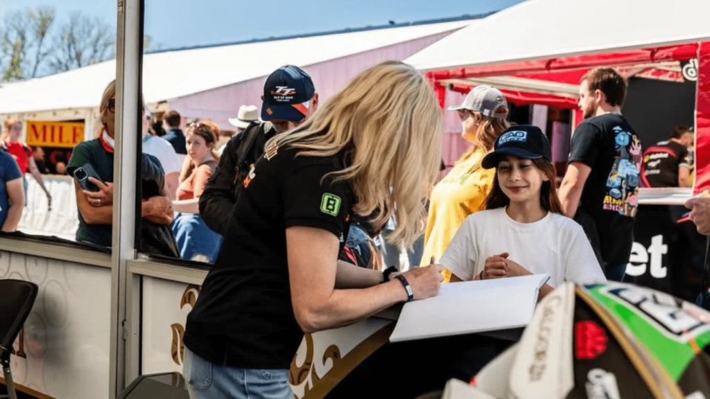Maria Costello with a fan at the Isle of Man TT. Credit: Maria Costello/Facebook.